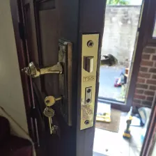 Mortice lock with brass handles repaired on a timber door