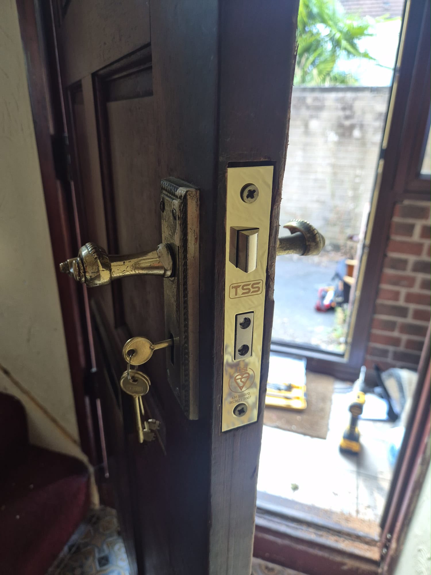 Mortice lock with brass handles repaired on a timber door