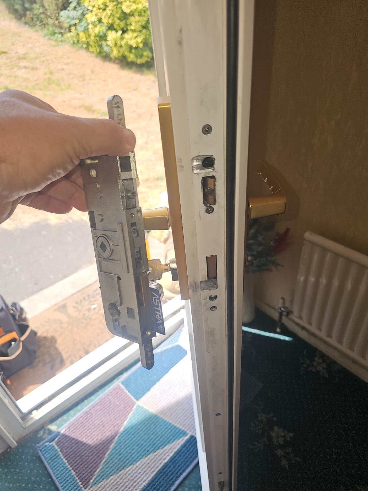 Multi-point door lock gearbox removed during a repair